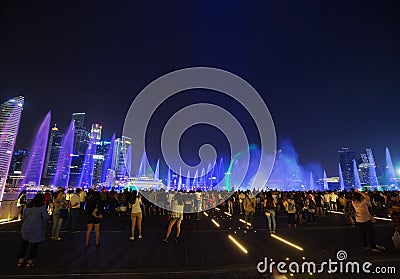 Tourists visit SPECTRA â€“ LIGHT & WATER SHOW at Marina bay sand Editorial Stock Photo